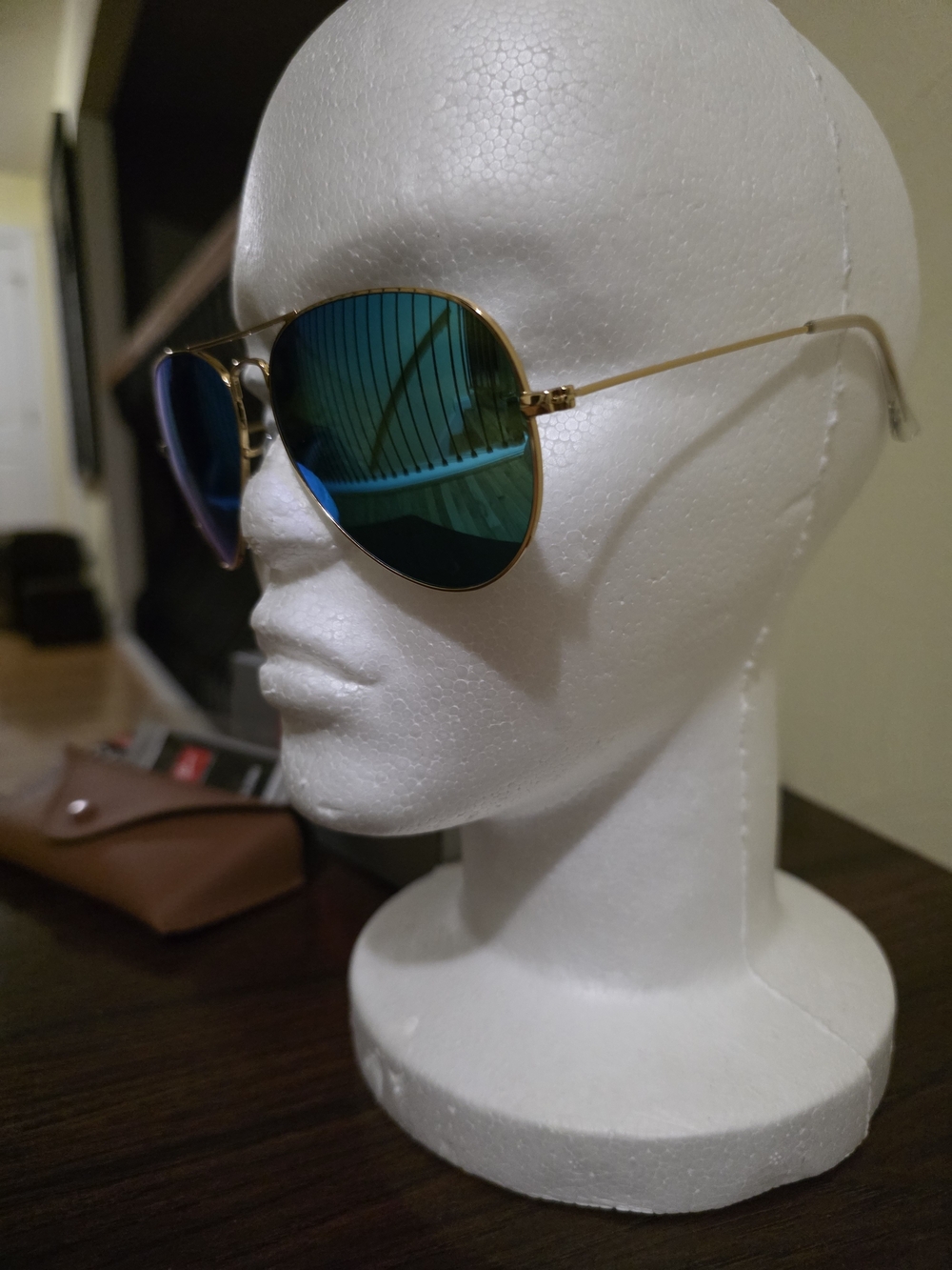 Ray-Ban Sunglasses with Light Blue Lenses and Gold Frame